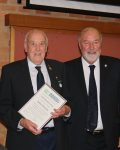 John Martin receiving his certificate, badge and plaque for life membership from Peter Shinton